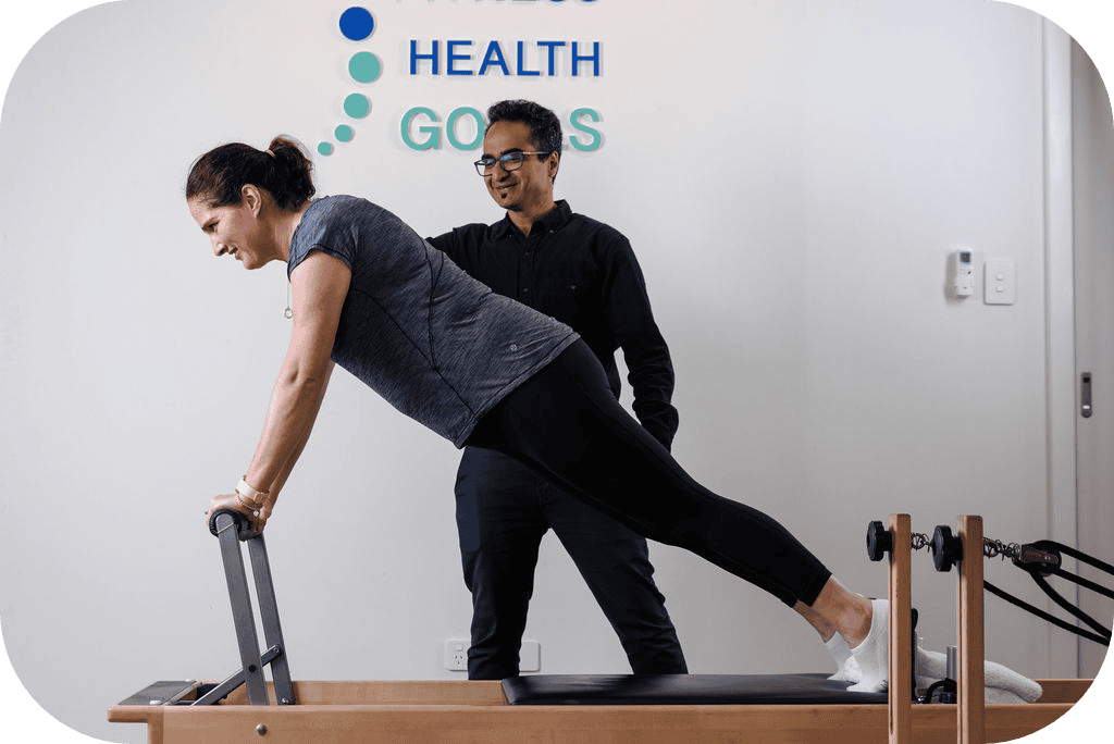 Patient performing guided rehabilitation exercises with a physiotherapist, focusing on recovery and strength-building after surgery at Therapia Physio, Adelaide.